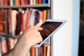 With computerised re-pricing programs roaming the online book world it might pay to check out your local library (Source: livecal/iStockPhoto)
